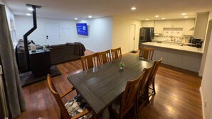 A compact living space with a dining area, kitchenette, and a small seating area. - Kipps Hill Haven B — Folsom Lake Escape (El Dorado Hills)