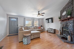 TV, fireplace, books - Modern Retreat for 8 w/Mountain Views & Large Deck (Sevierville)