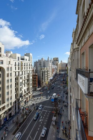 A multi-story hotel with a modern facade, located on a busy urban street with pedestrians and vehicles. - GRAN VIA capitals, PARiS (Madrid)
