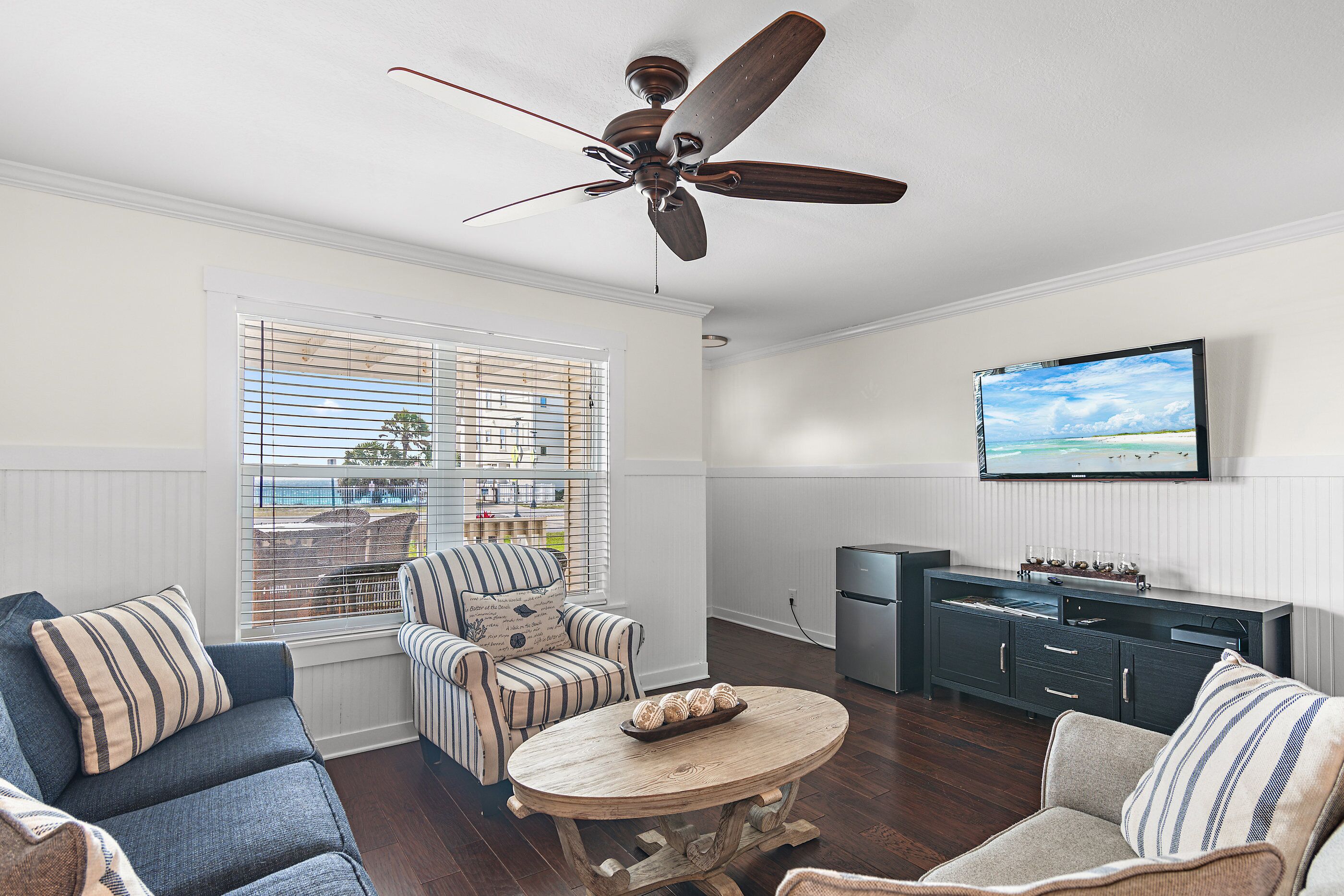 Gulf View Living Space - Plenty of Comfortable Seating in the Living Room situated around a large Smart TV + Access to the Front Covered Patio overlooking the Gulf of Mexico!