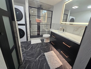 Shower, hair dryer, towels, soap