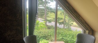 Kick back and relax in this calm, stylish with views of beautiful Strathnairn.