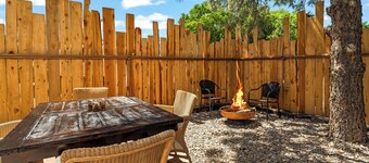 King Suite, kitchenette, private fenced patio with shared laundry and sauna on site.