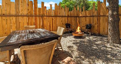 King Suite, kitchenette, private fenced patio with shared laundry and sauna on site.