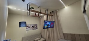 Apartamento superior, vista para a cidade | Parte interna