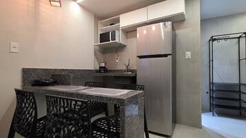 Comfort Apartment, City View | Private kitchen | Full-size fridge, microwave, stovetop, cookware/dishes/utensils