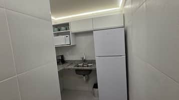 Apartamento superior, vista para a cidade | Parte interna