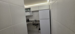 Apartamento superior, vista para a cidade | Parte interna