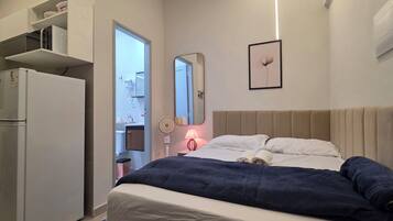 Standard Apartment, City View | Desk, laptop workspace, blackout drapes, soundproofing