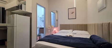 Standard Apartment, City View | Desk, laptop workspace, blackout drapes, soundproofing