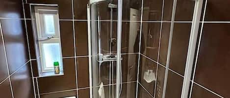 Shower, hair dryer, towels, soap