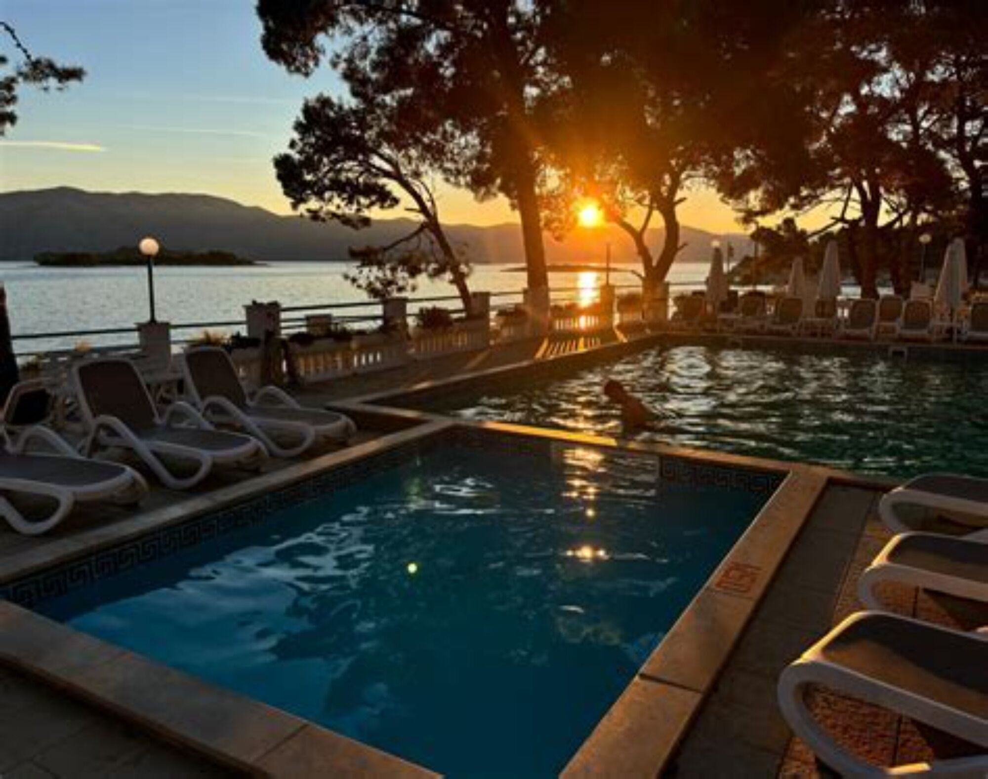 Seasonal outdoor pool, pool loungers