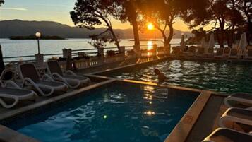 Seasonal outdoor pool, pool loungers