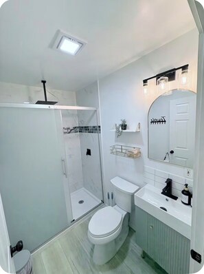 Shower, hair dryer, towels, soap