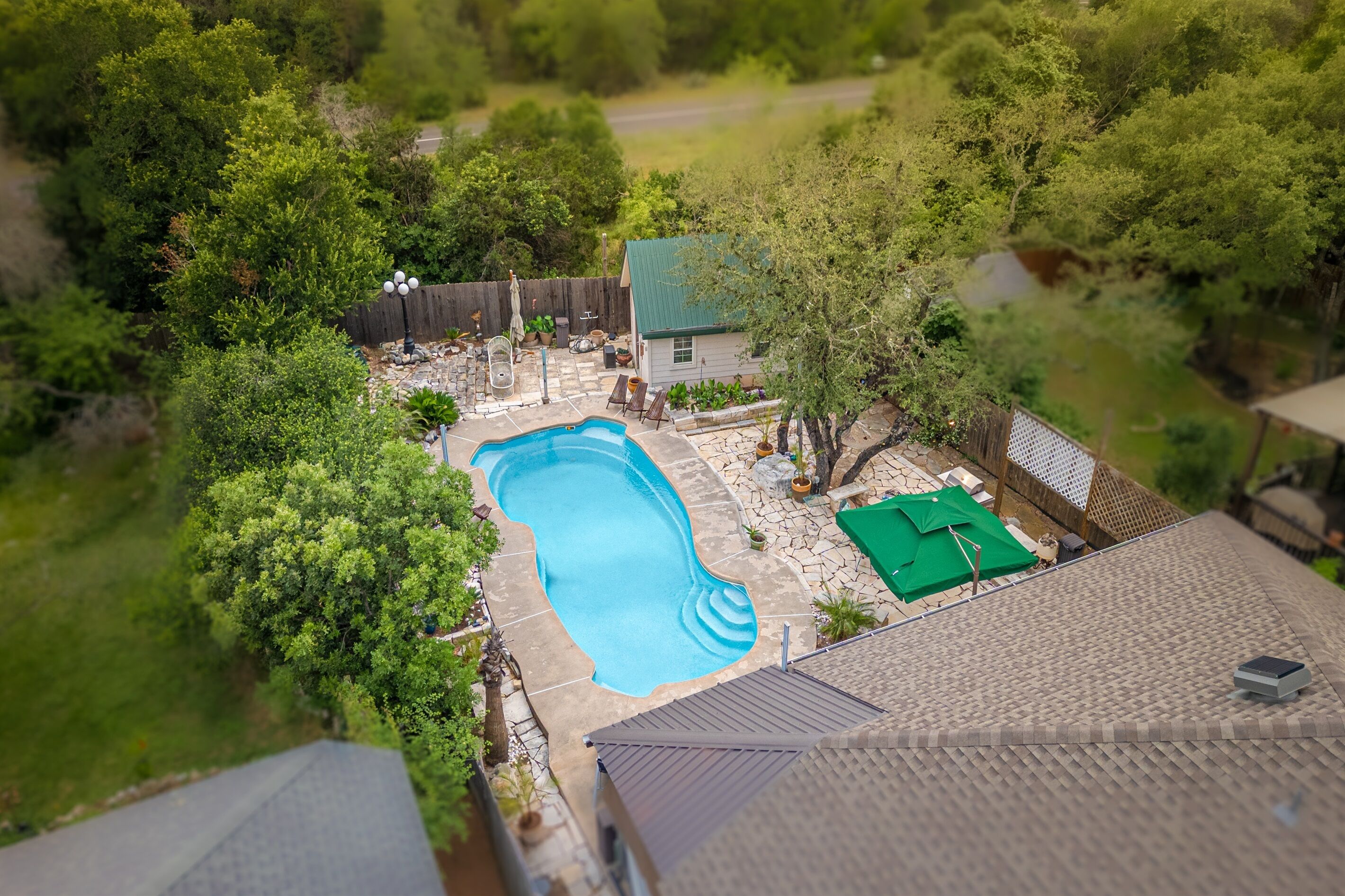 Welcome to your own private Backyard Oasis. Spa jets in pool bench seats & separate hot tub. Natural gas grill, oversized hammock for two, heated pool. Could it get any better?! Come, dive in ️
