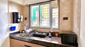 Fridge, microwave, stovetop, cookware/dishes/utensils