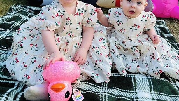 Two children sitting on a blanket outdoors with large inflatable toys and wrapped gifts in the background. - Enjoy a delightful campground experience in charming LaGrange (LaGrange)