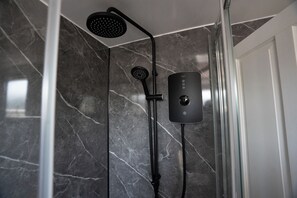 Shower, towels, soap, toilet paper