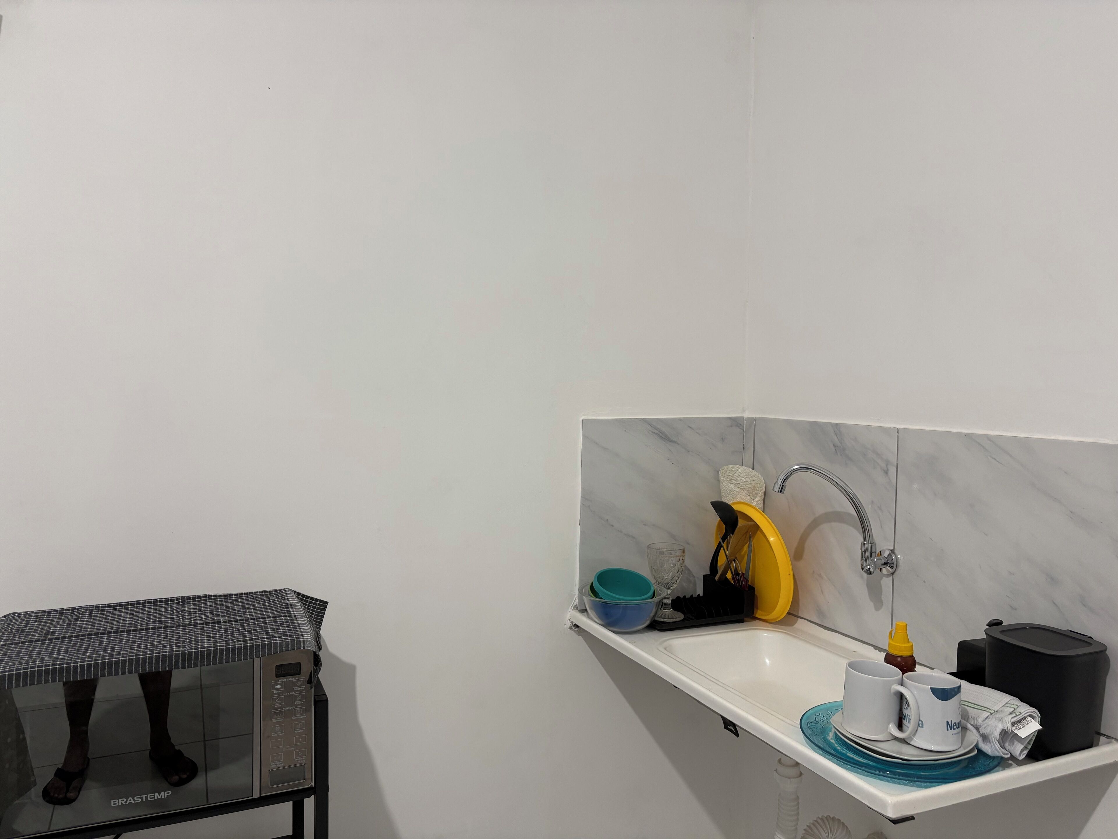 Microwave, cookware/dishes/utensils, dining tables