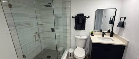 Shower, hair dryer, towels, soap