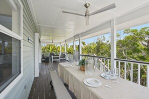 Outdoor dining - Salt + Sol | Canal-Front | Golf Cart | Heated Pool (Anna Maria)
