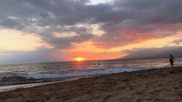 On the beach, sun loungers, beach towels