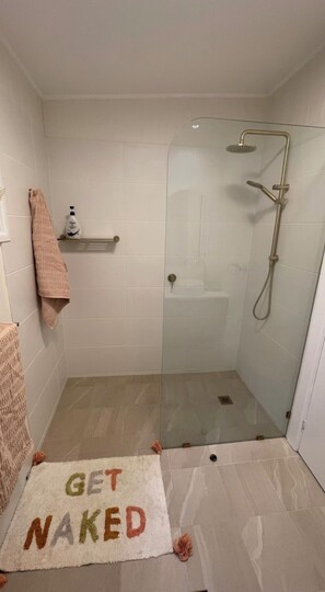 Shower, towels, soap, toilet paper
