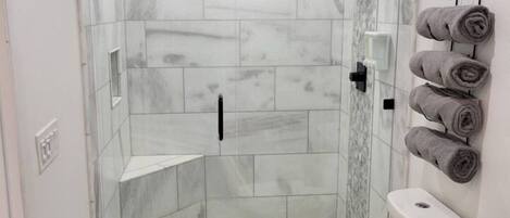 Shower, hair dryer, towels, soap