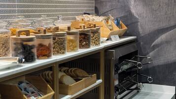 A bakery display with various breads, pastries, and a wine rack.