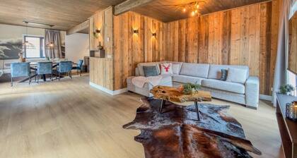 Chalet chaleureux avec sauna face Ă un lac alpin