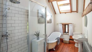 A bathroom with a shower, bathtub, and two sinks. - The Threshing Barn - UKC8847 (Blankney Fen)