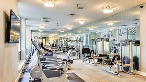 A gym with treadmills, weight machines, and mirrors. - 4 Mi to Dtwn, Commuter-Friendly Apt in Tacoma (Tacoma)