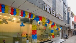A hotel with a modern facade, large windows, and a sign indicating it is a hotel. - Hotel Sona Deluxe @ 2Min From New Delhi Railway Station (New Delhi)