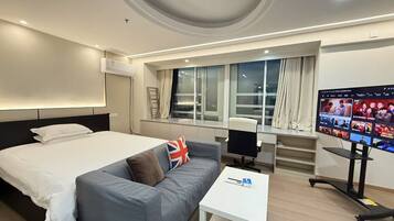 Executive Studio Suite, City View | Desk, laptop workspace, blackout drapes, free WiFi