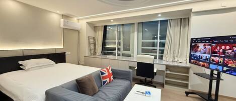 Desk, laptop workspace, blackout curtains, free WiFi