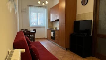 Apartment, City View | Living area | Flat-screen TV