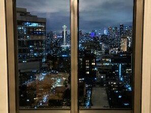 A nighttime cityscape with a prominent tower and dense building clusters. - LeMoon's Chill with beautiful view  (Pasay)