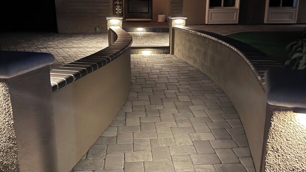 A paved pathway leading to a house entrance with steps and a door, surrounded by walls and a garage. - Private Luxury Oasis – Fully Renovated with Huge Backyard (Mission Viejo)