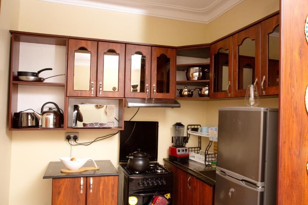 Departamento, balcón, vista a la ciudad | Cocina privada | Refrigerador y microondas 