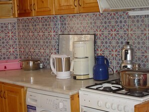 Fridge, oven, cookware/dishes/utensils
