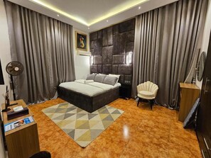 Deluxe Apartment, Balcony, City View | Desk, laptop workspace, blackout drapes, soundproofing - Ennyln Apartment (Abuja)