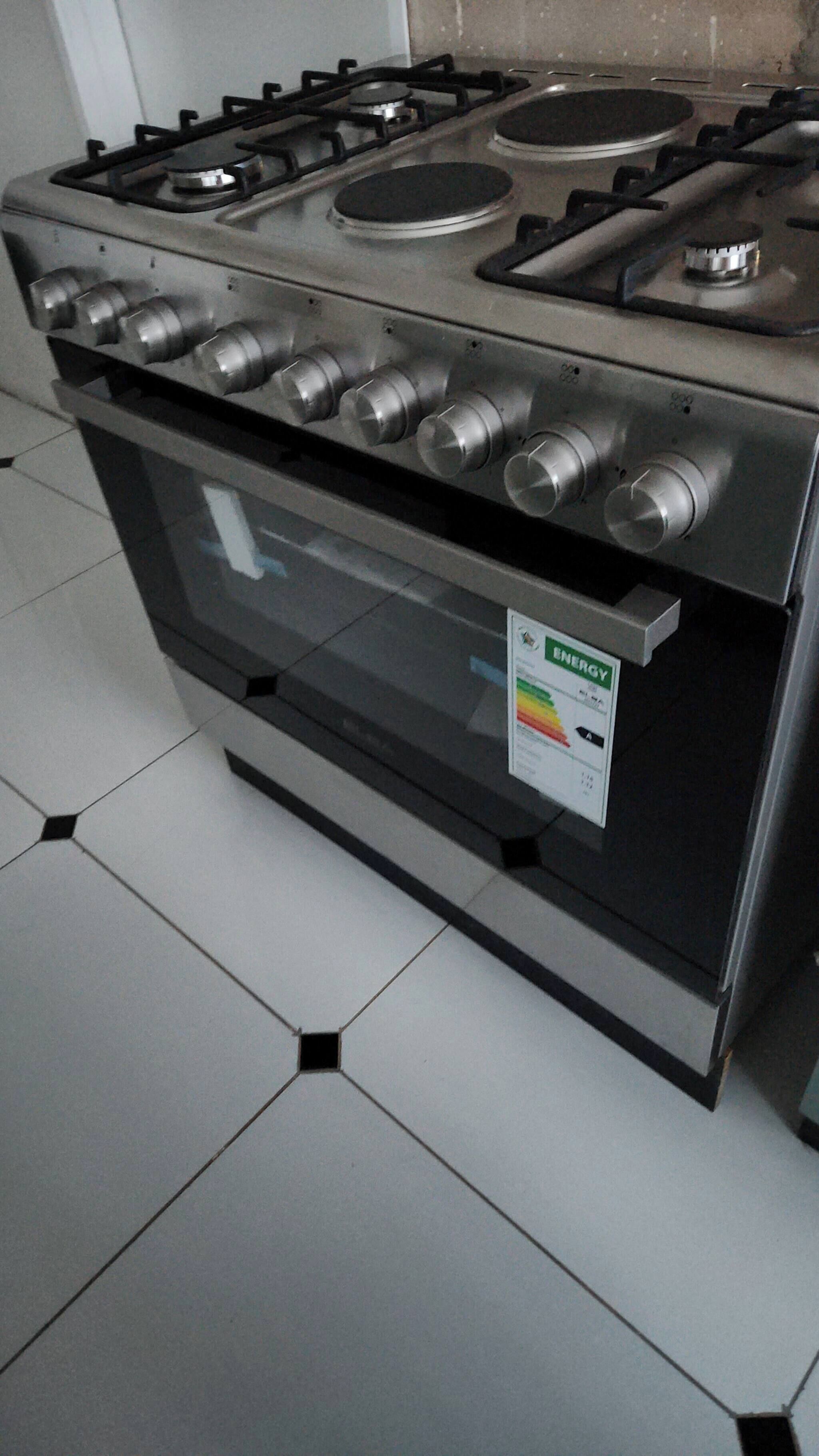 A stainless steel range with a built-in oven and a visible energy efficiency label.