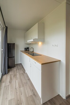 Fridge, microwave, stovetop, coffee/tea maker