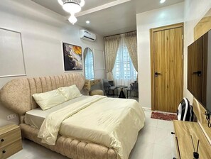 Deluxe Apartment, Balcony, City View | In-room safe, desk, laptop workspace, blackout drapes - Oputa Jay Apartment (Abuja)