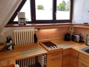 Fridge, stovetop, coffee/tea maker, electric kettle