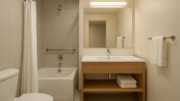 Deluxe Room | Bathroom | Shower, hair dryer, towels, soap