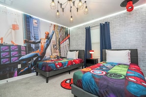 A bedroom with two beds, a Spider-Man mural, a brick wall, and a hanging light fixture. - Private Pool - Themed Rooms - Near Disney 4239 (Kissimmee)