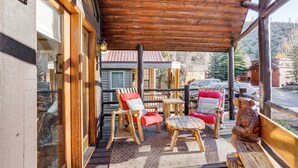 A wooden deck with outdoor seating and a view of a mountain. - 4 Mi to Slopes! Breck Mtn Base w/ Hot Tub Access (Breckenridge)