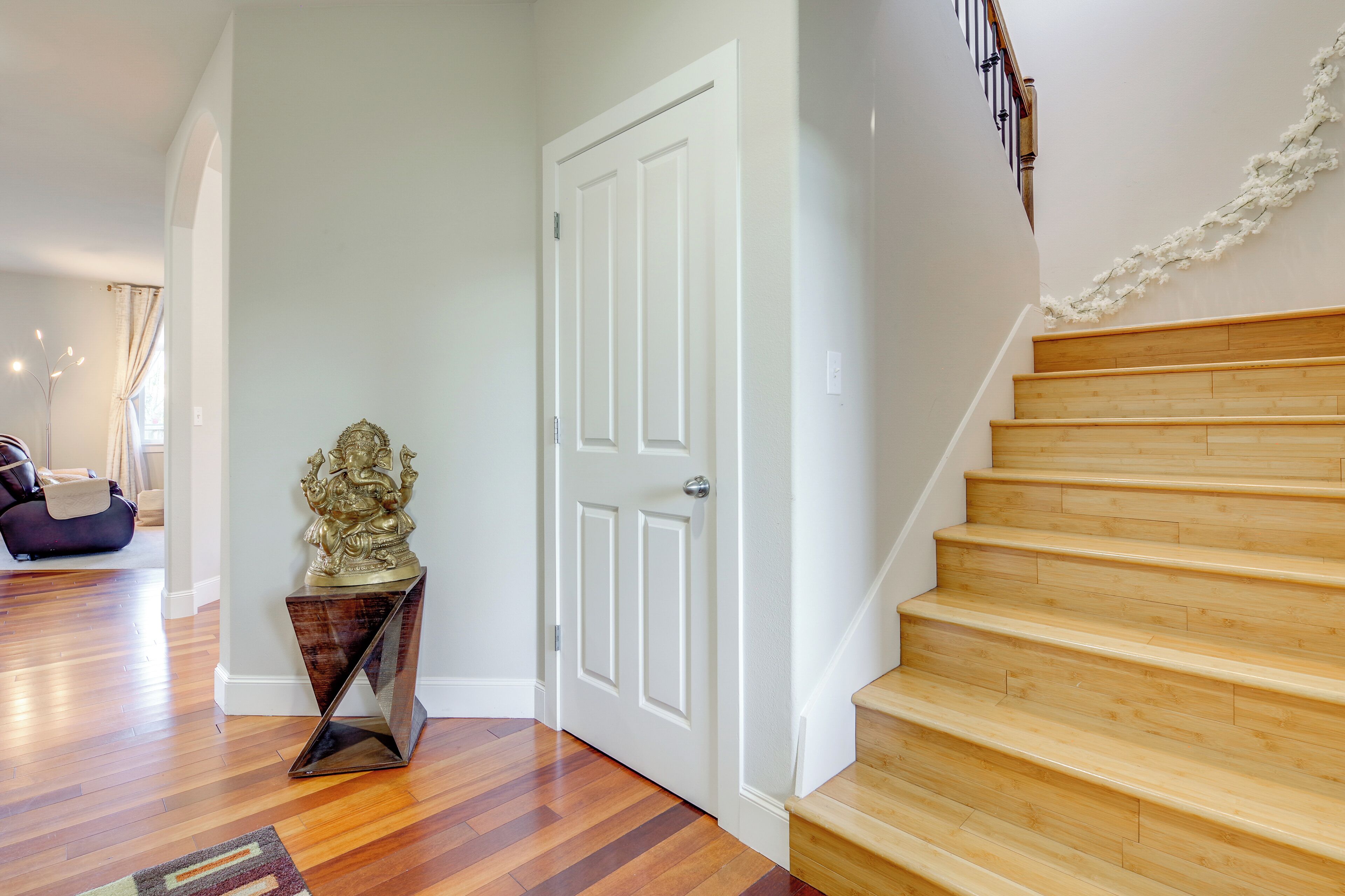 A staircase with wooden steps leading to a landing.