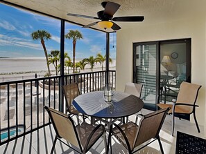 Outdoor dining - Carlos Pointe 121 | Stylish Retreat w/Gulf Views, Balcony + Community Pool (Fort Myers Beach)